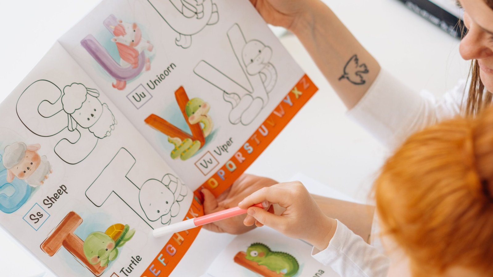 Activity books for preschoolers including alphabet tracing and number learning activities