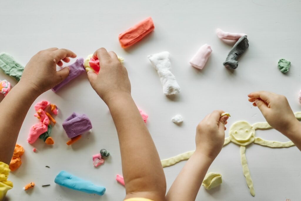 preschool child developing fine motor skills through play